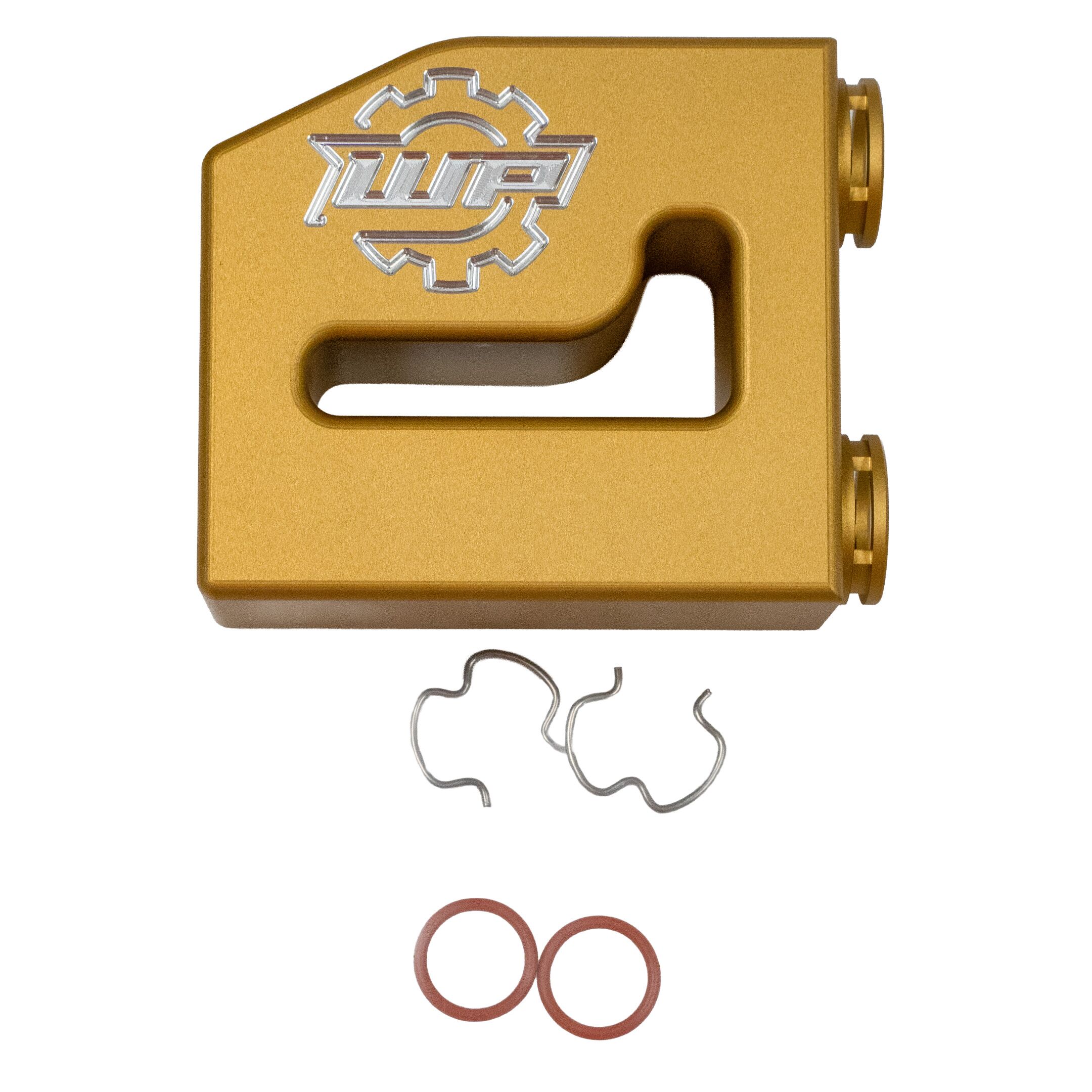 thermalbypass_13-19 - WP Developments close-up of a gold anodized metal part with a silver embossed logo, plus loose wire pieces and red rubber o-rings nearby.